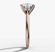 Four-Claw Tapered Solitaire Engagement Ring with Round Brilliant Cut Diamond