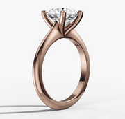 Four-Claw Tapered Solitaire Engagement Ring with Round Brilliant Cut Diamond