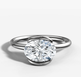 East West Half Bezel Engagement Ring with Oval Cut Diamond