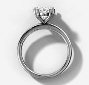 Double Claw Signature Solitaire Engagement Ring with Oval Cut Diamond