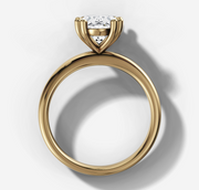 Double Claw Signature Solitaire Engagement Ring with Oval Cut Diamond