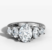 Five Stone Engagement Ring with Oval Cut Diamond