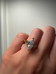 Baguette Accent Engagement Ring with Marquise Cut Diamond